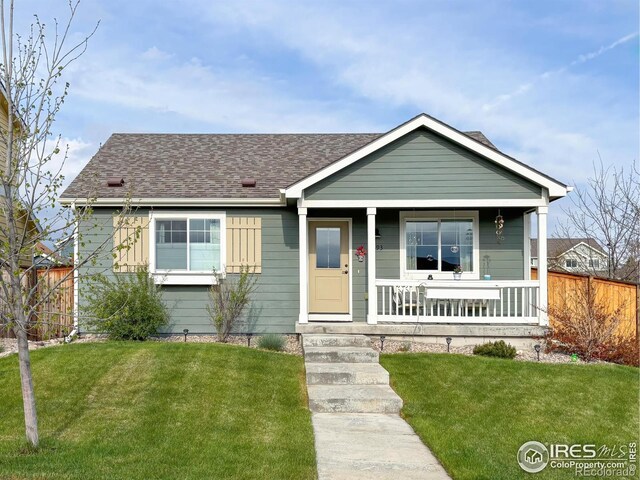 view of front of house with covered porch and roof with shingles