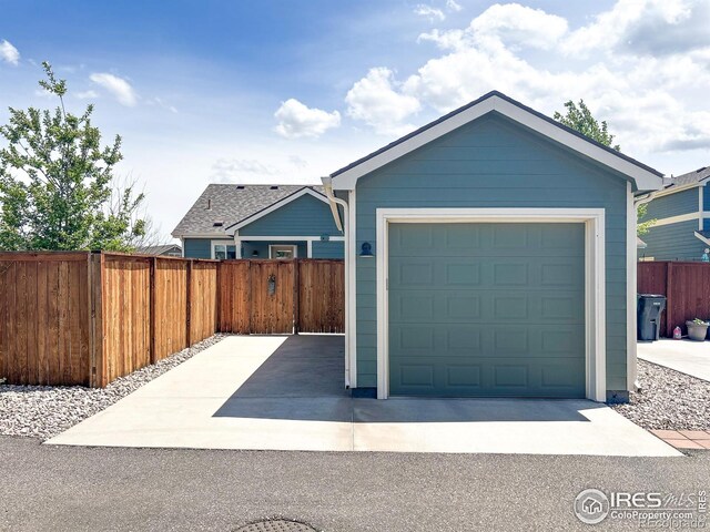 detached garage with fence