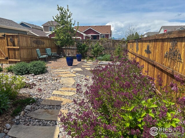 fenced backyard featuring a patio area
