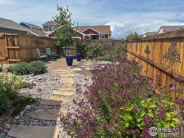 2793 Red Wheat Trl, Berthoud, CO 80513 - fenced backyard featuring a patio area
