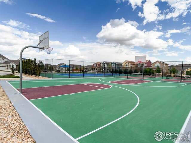 view of sport court featuring community basketball court and fence