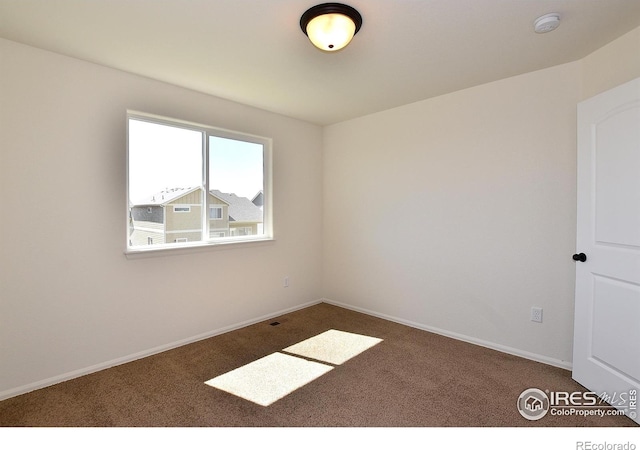 8516 8th St, Greeley, CO 80634 - carpeted empty room with baseboards and a smoke detector
