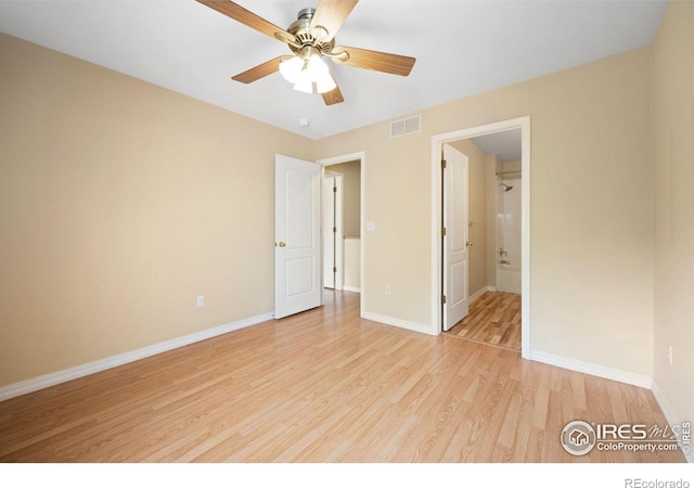 unfurnished room featuring light wood-style flooring, baseboards, and a ceiling fan