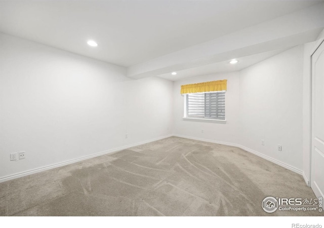 below grade area featuring carpet, baseboards, and recessed lighting