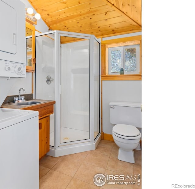 1221 Griffith Ct, Estes Park, CO 80517 - bathroom featuring stacked washer / dryer, wood ceiling, a shower stall, vanity, and tile patterned floors