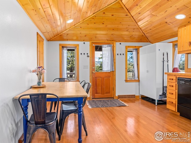 1221 Griffith Ct, Estes Park, CO 80517 - dining area featuring vaulted ceiling, wood ceiling, healthy amount of natural light, wood finished floors, and baseboards