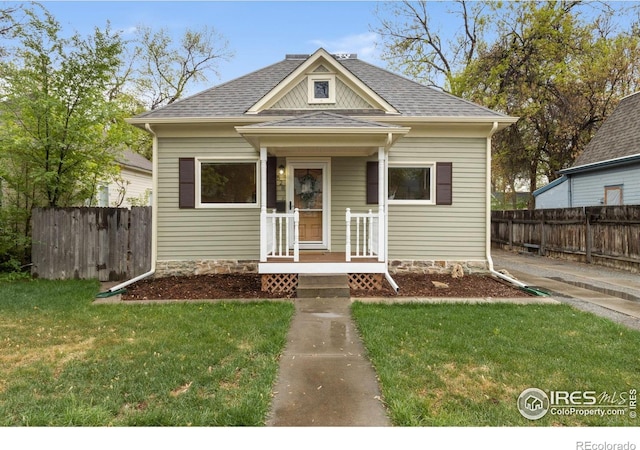 bungalow-style house featuring roof with shingles