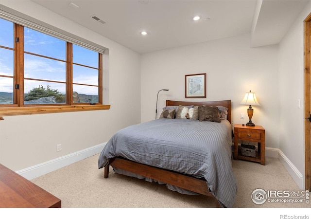 carpeted bedroom with baseboards and recessed lighting