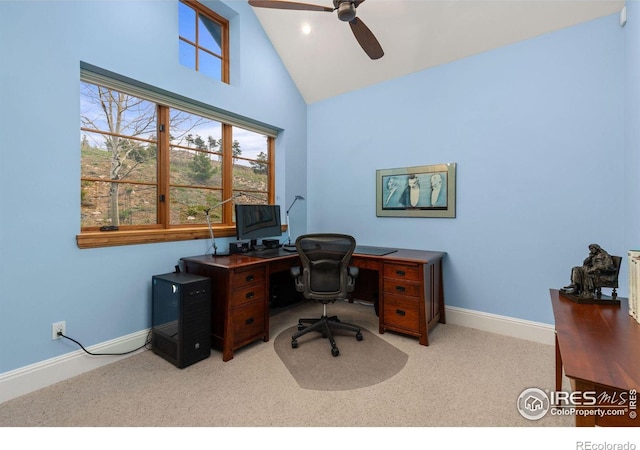 carpeted home office featuring ceiling fan, baseboards, and high vaulted ceiling