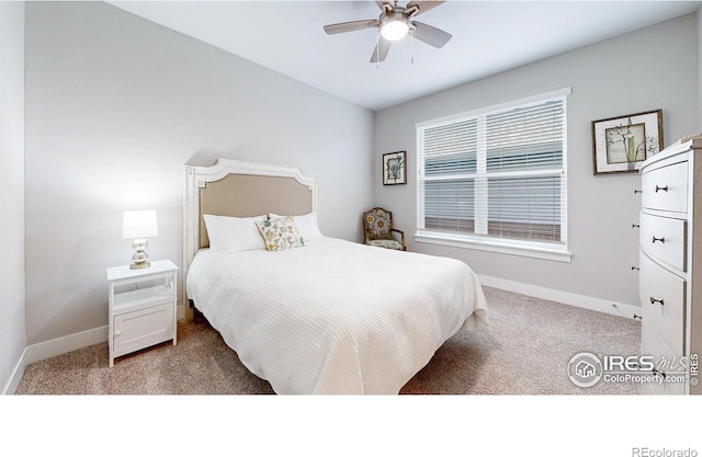 carpeted bedroom with baseboards and a ceiling fan