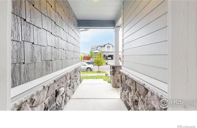 view of property exterior with a porch