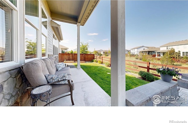 2137 Setting Sun Dr, Windsor, CO 80550 - view of patio / terrace featuring a residential view and an outdoor living space