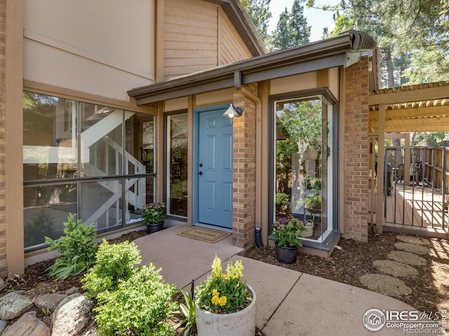 700 Poplar Ave, Boulder, CO 80304 - doorway to property featuring brick siding and fence