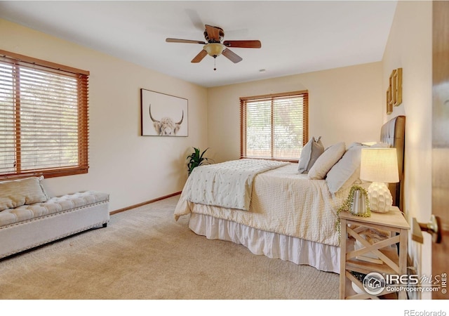 bedroom featuring carpet floors, baseboards, and ceiling fan