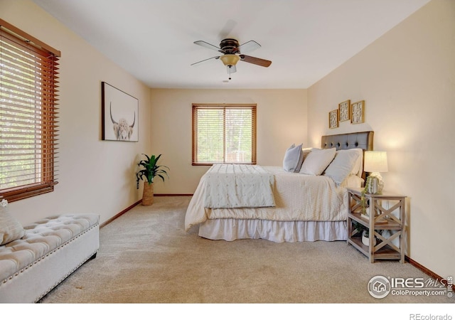 bedroom featuring carpet, baseboards, and ceiling fan