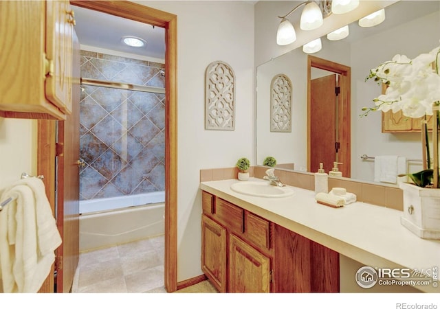 bathroom featuring vanity and enclosed tub / shower combo
