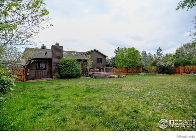 view of yard featuring a deck