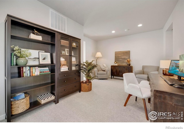 sitting room with carpet, recessed lighting, and a desk