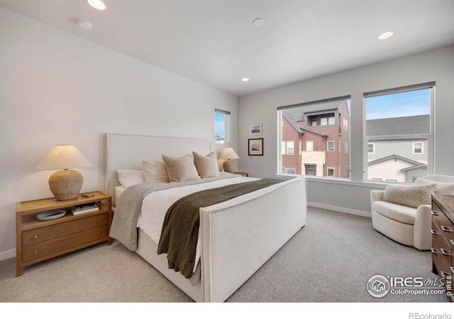 carpeted bedroom with recessed lighting and baseboards