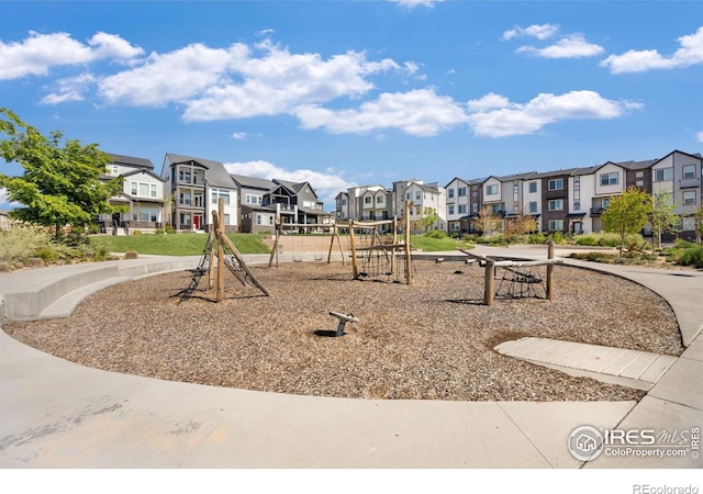 community jungle gym with a residential view