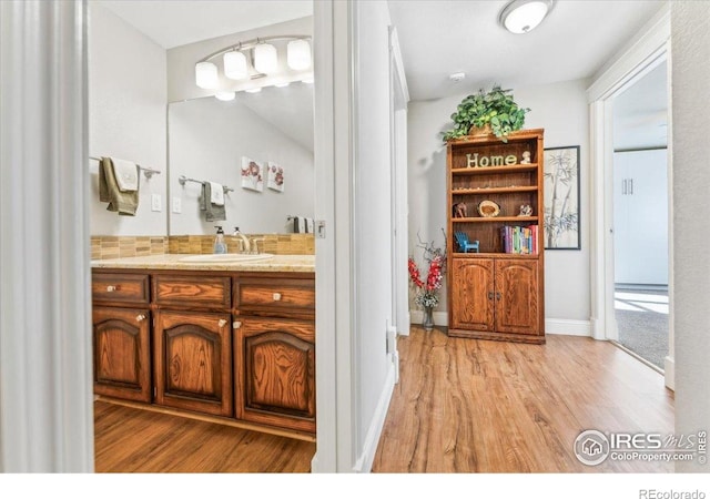 4880 Filbert Dr, Loveland, CO 80538 - bathroom with wood finished floors and vanity
