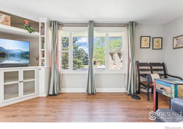4880 Filbert Dr, Loveland, CO 80538 - sitting room featuring wood finished floors and baseboards