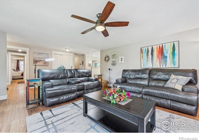 4880 Filbert Dr, Loveland, CO 80538 - living room featuring ceiling fan, wood finished floors, and baseboards