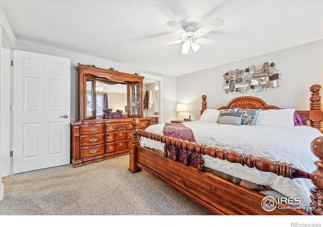 4880 Filbert Dr, Loveland, CO 80538 - carpeted bedroom with ceiling fan and connected bathroom