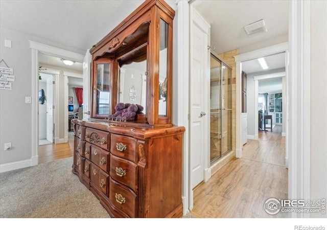 4880 Filbert Dr, Loveland, CO 80538 - corridor featuring baseboards and light wood-type flooring