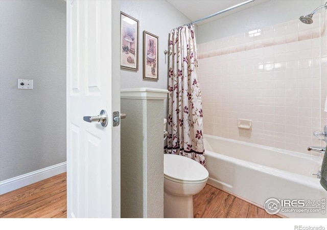 4880 Filbert Dr, Loveland, CO 80538 - full bathroom featuring wood finished floors, shower / tub combo with curtain, and toilet