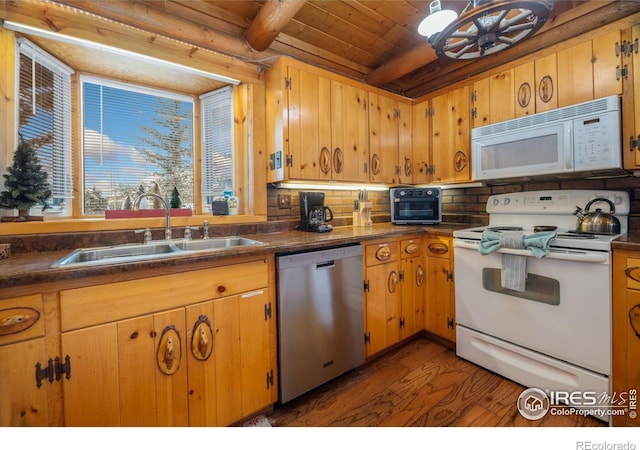 1810 N Ridge Ln, Estes Park, CO 80517 - kitchen featuring white appliances, a sink, wood finished floors, dark countertops, and beamed ceiling