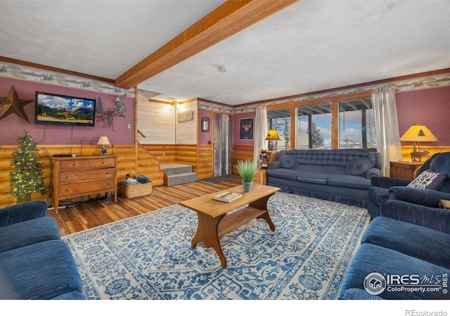 1810 N Ridge Ln, Estes Park, CO 80517 - living area featuring rustic walls, wood finished floors, beamed ceiling, and stairs