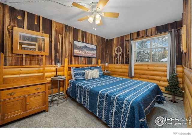 1810 N Ridge Ln, Estes Park, CO 80517 - carpeted bedroom featuring rustic walls and a ceiling fan