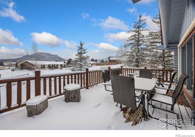 1810 N Ridge Ln, Estes Park, CO 80517 - snow covered deck with outdoor dining space and a mountain view