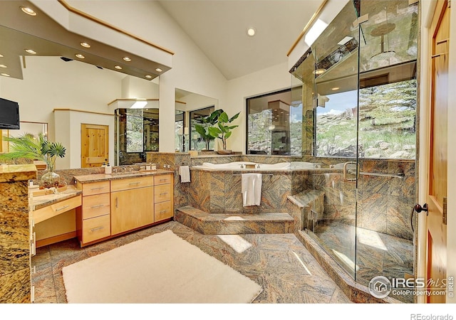 6553 Sunshine Canyon Dr, Boulder, CO 80302 - full bathroom featuring recessed lighting, a shower stall, vanity, lofted ceiling, and a garden tub