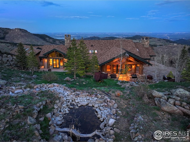 6553 Sunshine Canyon Dr, Boulder, CO 80302 - rear view of house featuring a chimney and a patio