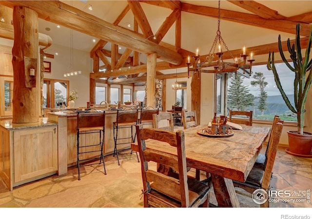 6553 Sunshine Canyon Dr, Boulder, CO 80302 - dining area featuring high vaulted ceiling, a chandelier, recessed lighting, beam ceiling, and light stone finish floors