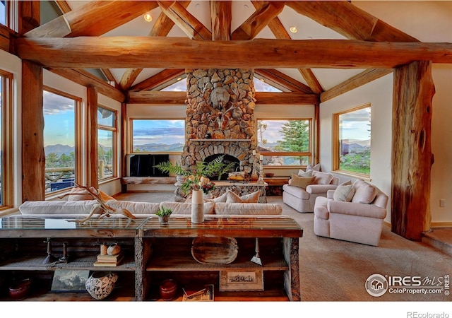 6553 Sunshine Canyon Dr, Boulder, CO 80302 - carpeted living room with a stone fireplace and baseboards