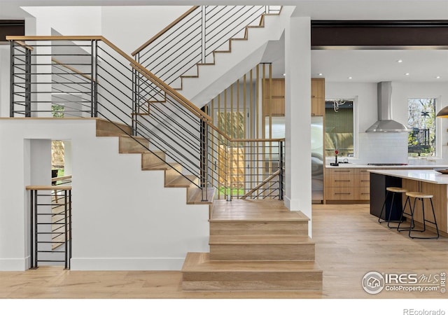 2814 3rd St, Boulder, CO 80304 - staircase featuring wood finished floors, baseboards, and recessed lighting