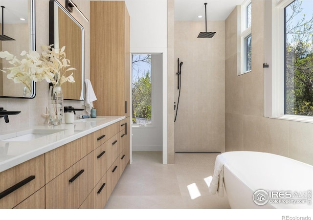 2814 3rd St, Boulder, CO 80304 - full bathroom with a walk in shower, a freestanding tub, double vanity, and tile patterned floors