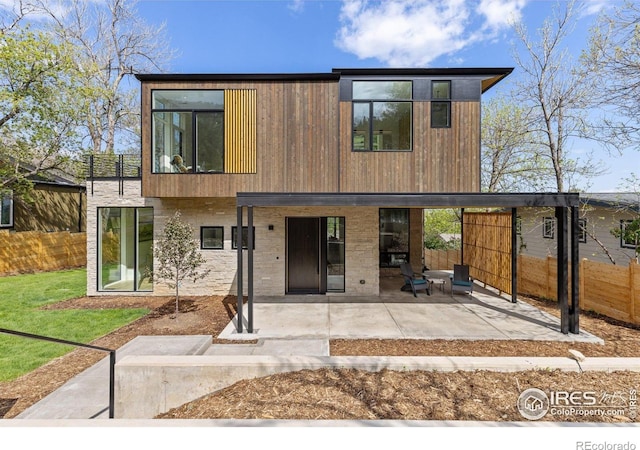 2814 3rd St, Boulder, CO 80304 - contemporary house with a patio and fence