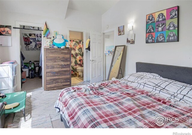 bedroom featuring a walk in closet, a closet, carpet, and connected bathroom