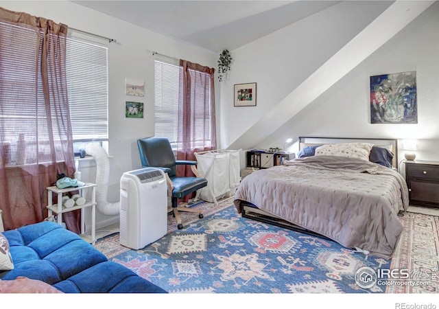 bedroom with lofted ceiling