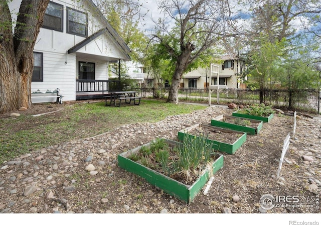 view of yard with a garden and fence