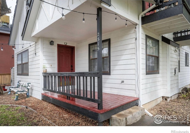 doorway to property featuring a porch