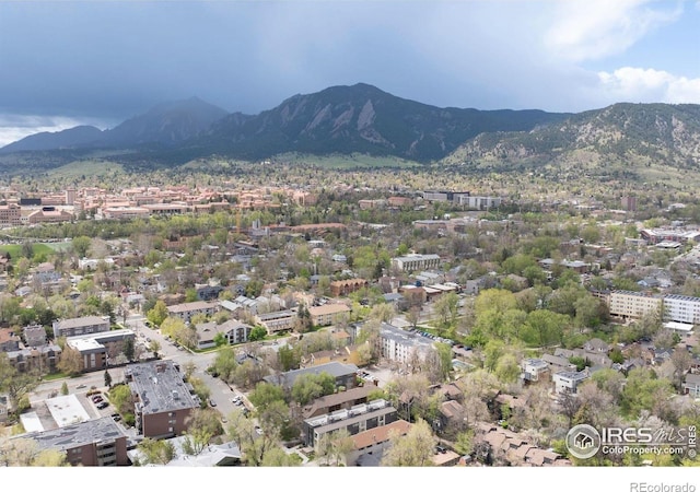 aerial overview of property's location featuring a mountainous background