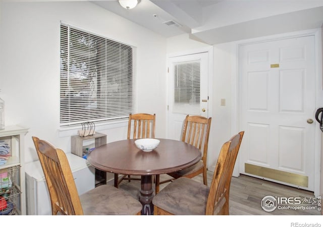 dining space featuring wood finished floors