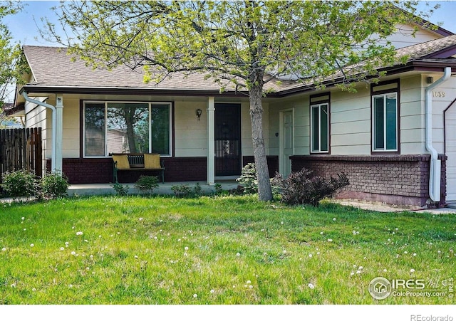 ranch-style house with a porch and brick siding