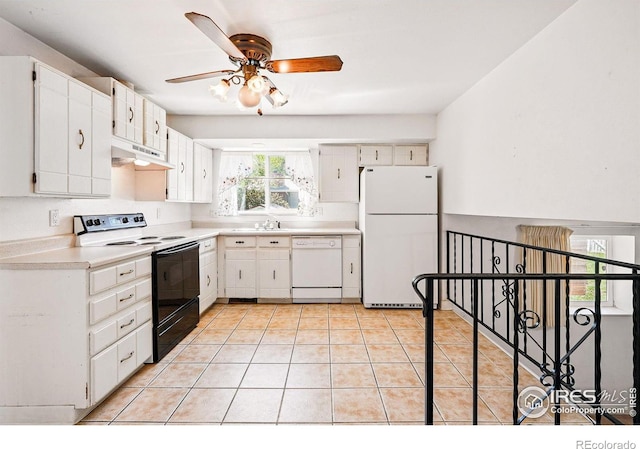 kitchen featuring white appliances, under cabinet range hood, ceiling fan, light tile patterned floors, and light countertops