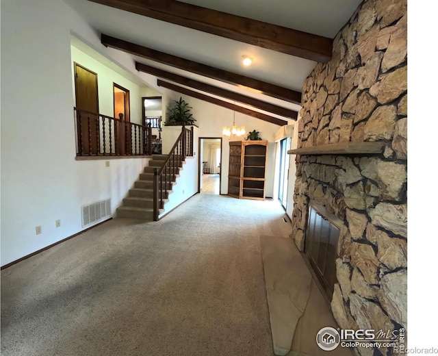 718 Linda St, Fort Morgan, CO 80701 - unfurnished living room featuring a chandelier, carpet flooring, stairway, and a fireplace
